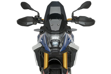 Puig 23209W Clear Headlight Protector BMW F450GS 2026, scratch-resistant polycarbonate motorcycle headlight guard with UV protection, black epoxy-coated steel mounting brackets and fitting kit_1