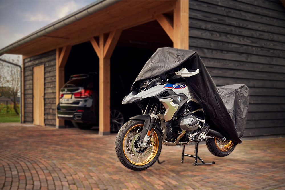 Waterproof DS Alfa outdoor motorcycle cover protecting a bike from rain and weather