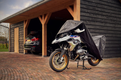 Waterproof DS Alfa outdoor motorcycle cover protecting a bike from rain and weather