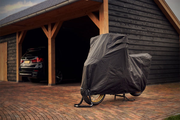 Waterproof DS Alfa outdoor motorcycle cover protecting a bike from rain and weather_1